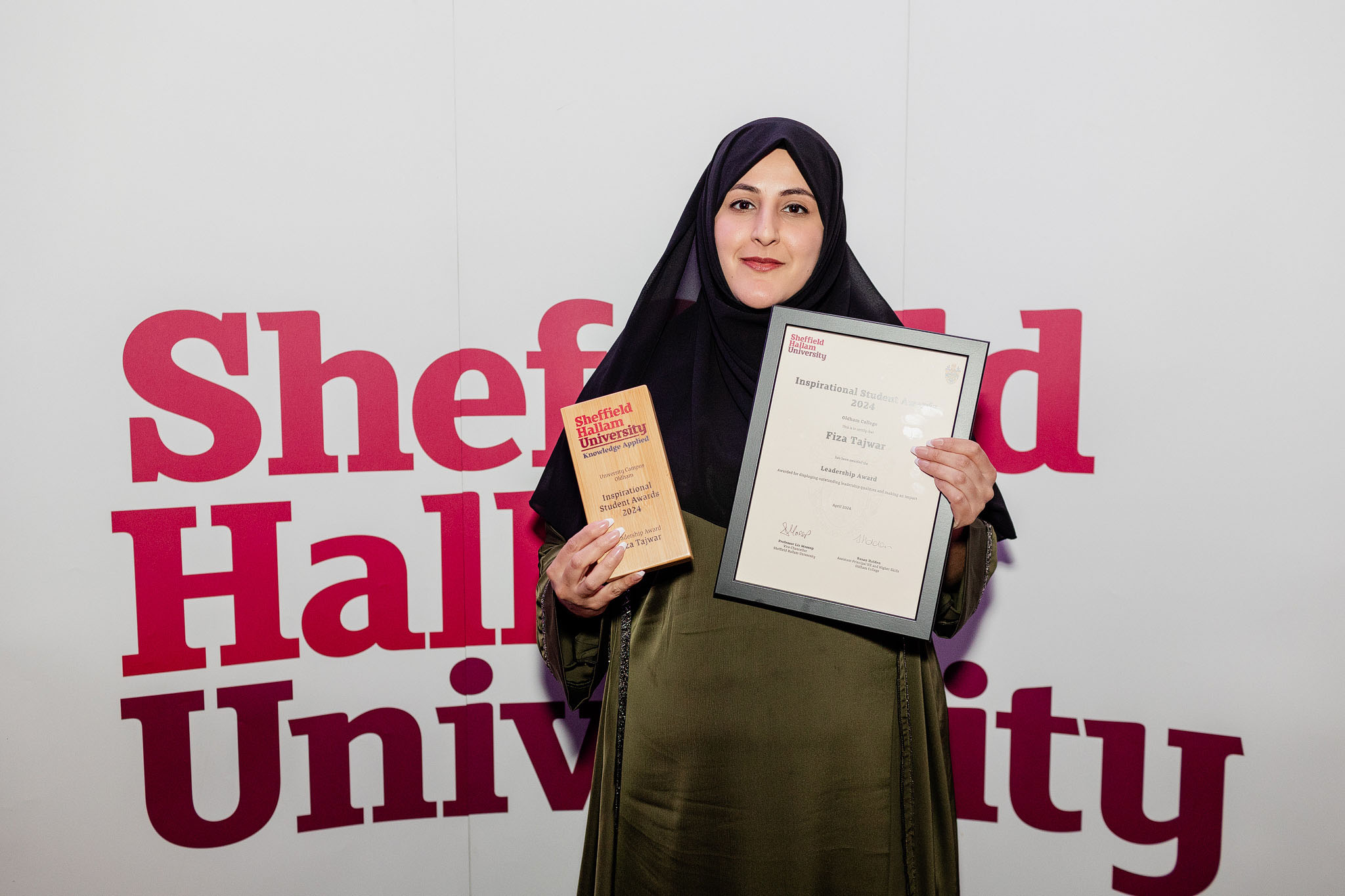 Fiza Tajwar holds a certificate 