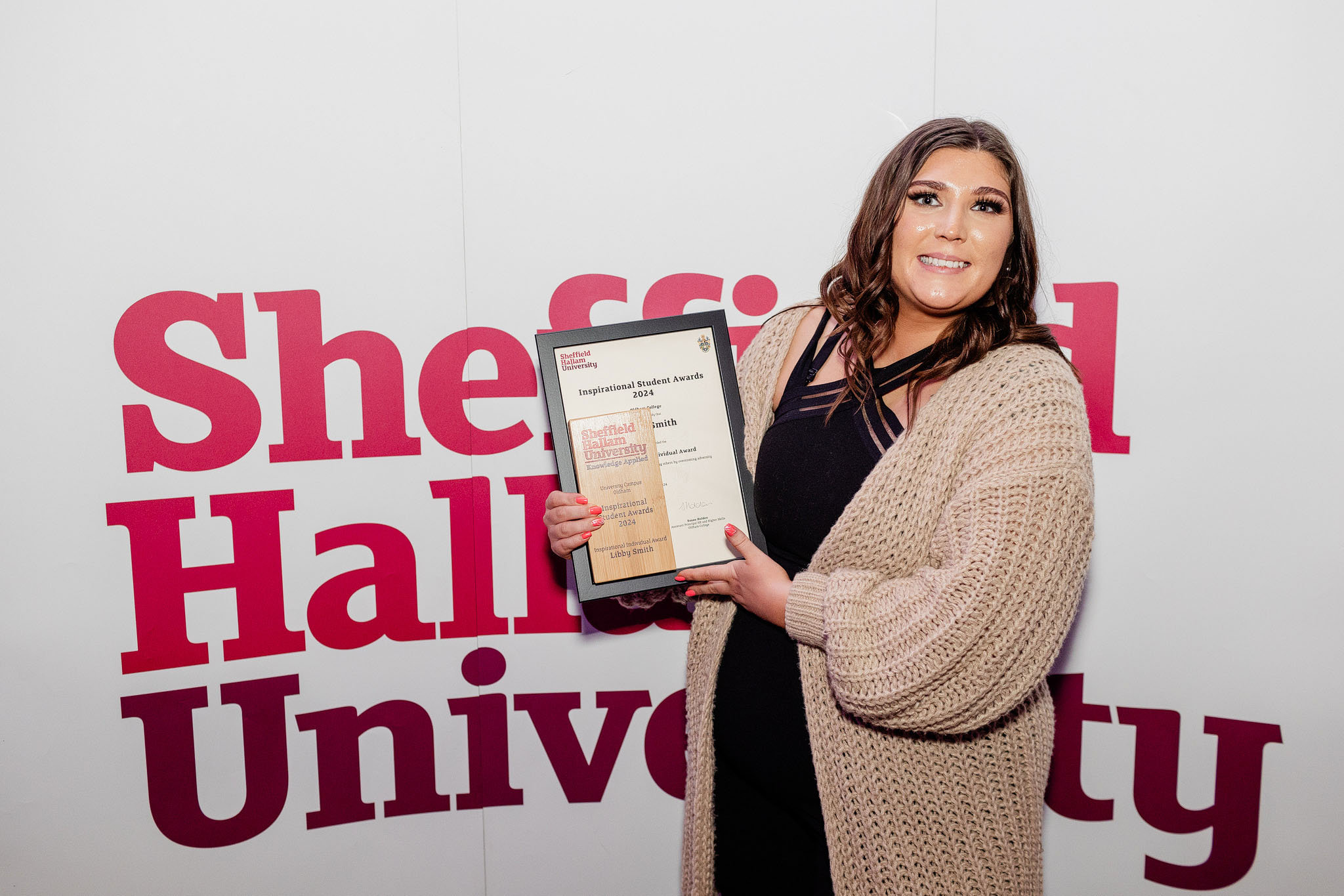Libby Smith holds a certificate