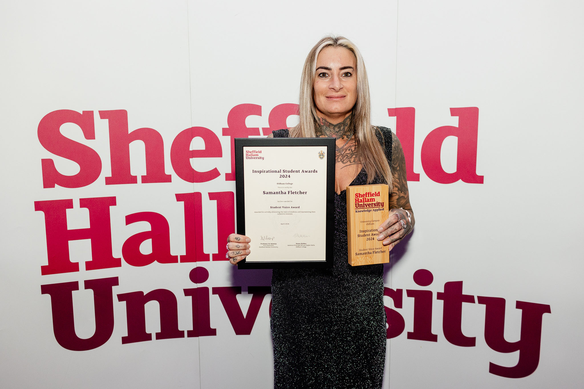 Samantha Fletcher holds a certificate