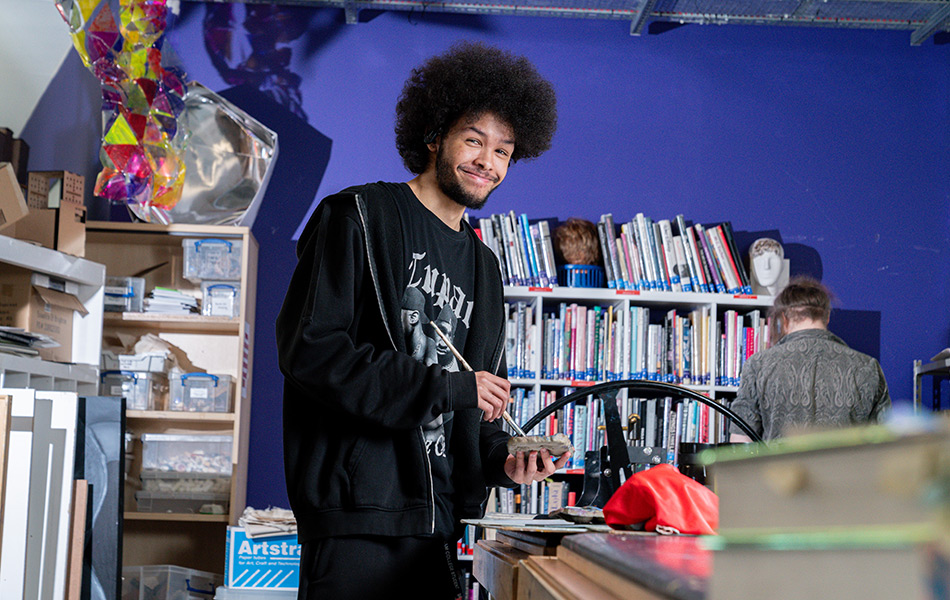 Young male student working on his art