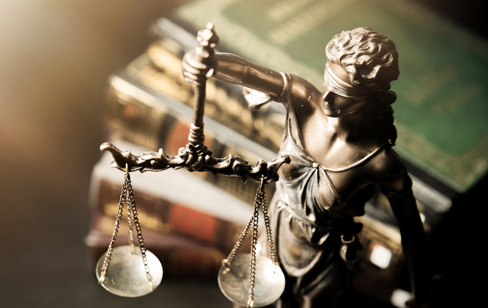 Legal statue holding the scales of justice