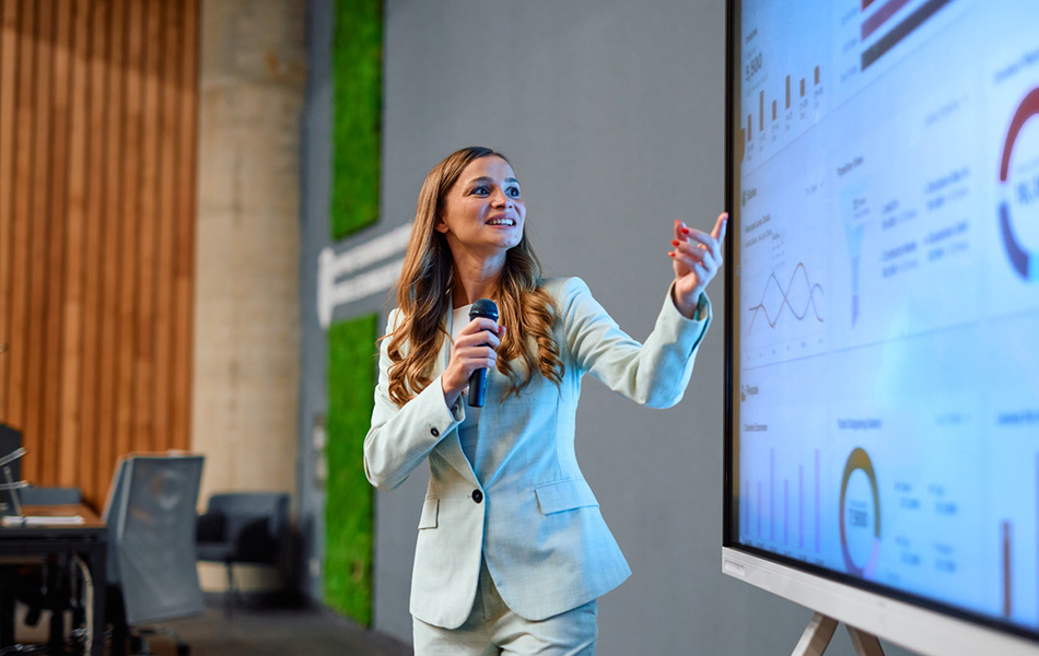 Young girl presenting marketing information on stage